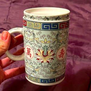 Ornate Chinese porcelain tea cup with Strainer